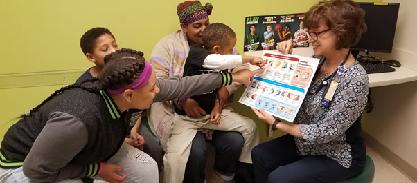 family looking at asthma guide