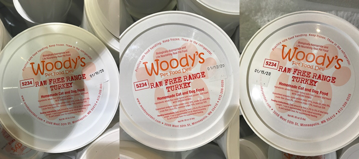 Pictures of Woody's pet food containers