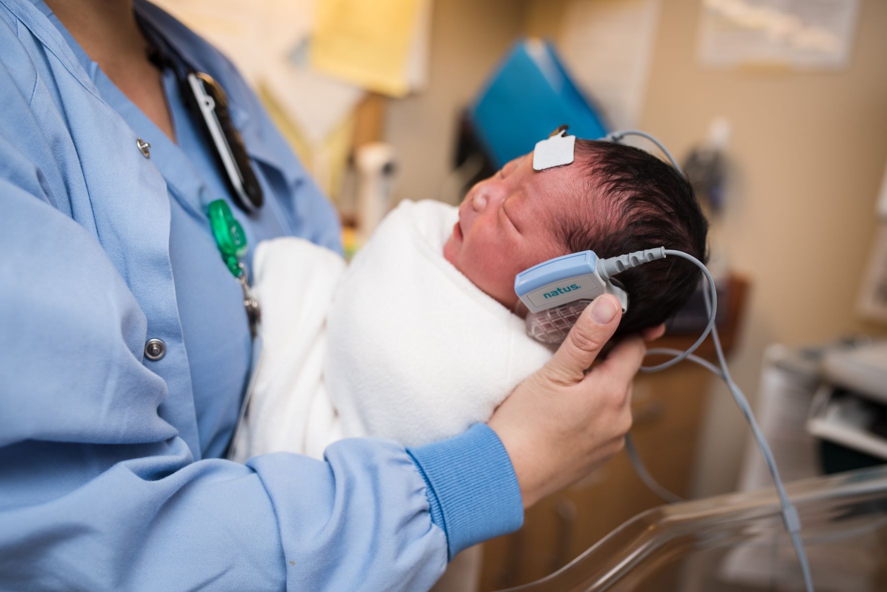 Newborn baby undergoing hearing screening