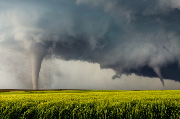 tornado moving across farm field