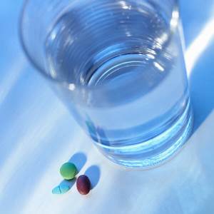 photo of pills and a glass of water