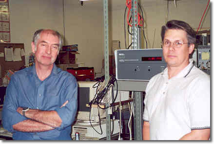 David Blackford and Tom Kerrick in front of the non-volatile residue monitor that they manufacture and sell.