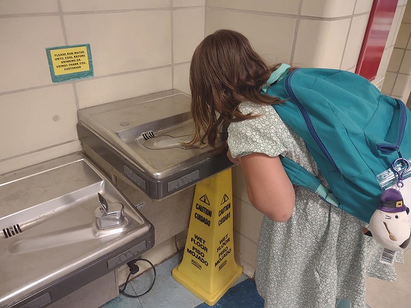 Kid at drinking fountain