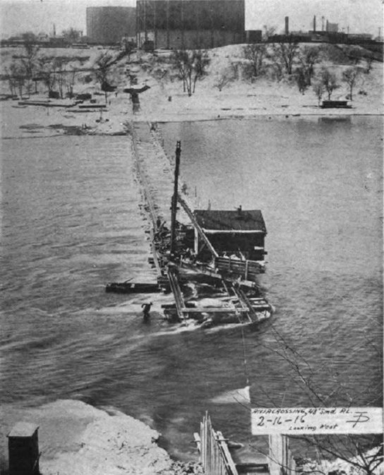 1916 photo of trenching for a waterline in the Mississippi River