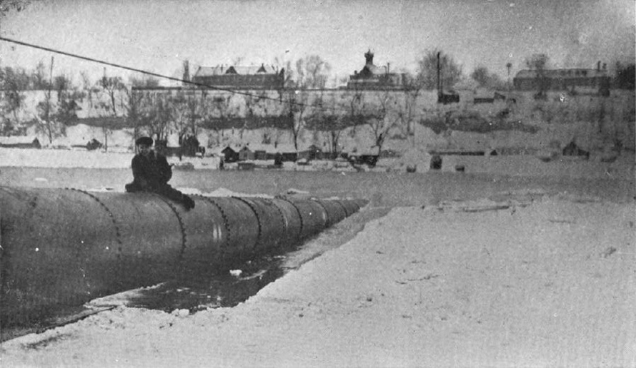 1917 photo of the waterline being installed in the Mississippi River