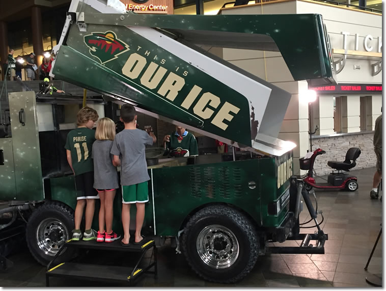 People putting water into Zamboni at Xcel Energy Center