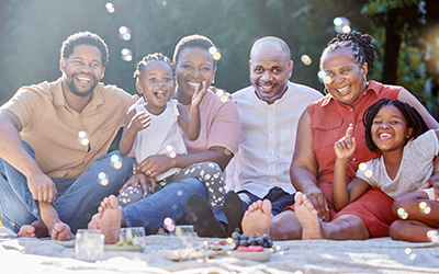 black family sitting in park