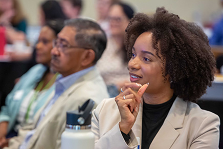Blaire Rodenbiker, Rodolfo Gutierrez, and other councilmembers and staff listen an event speaker