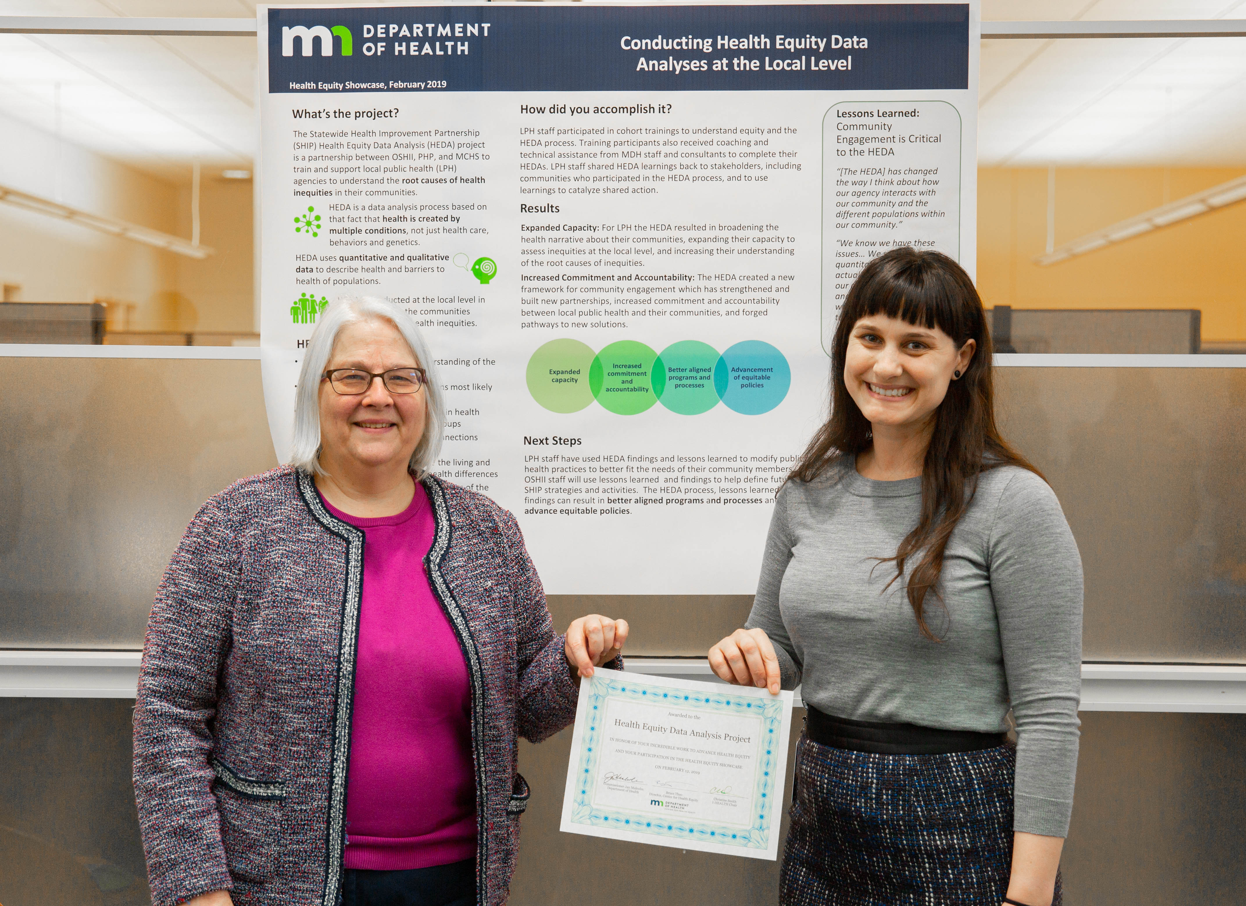 Photo of project lead with poster - health equity data analyses project