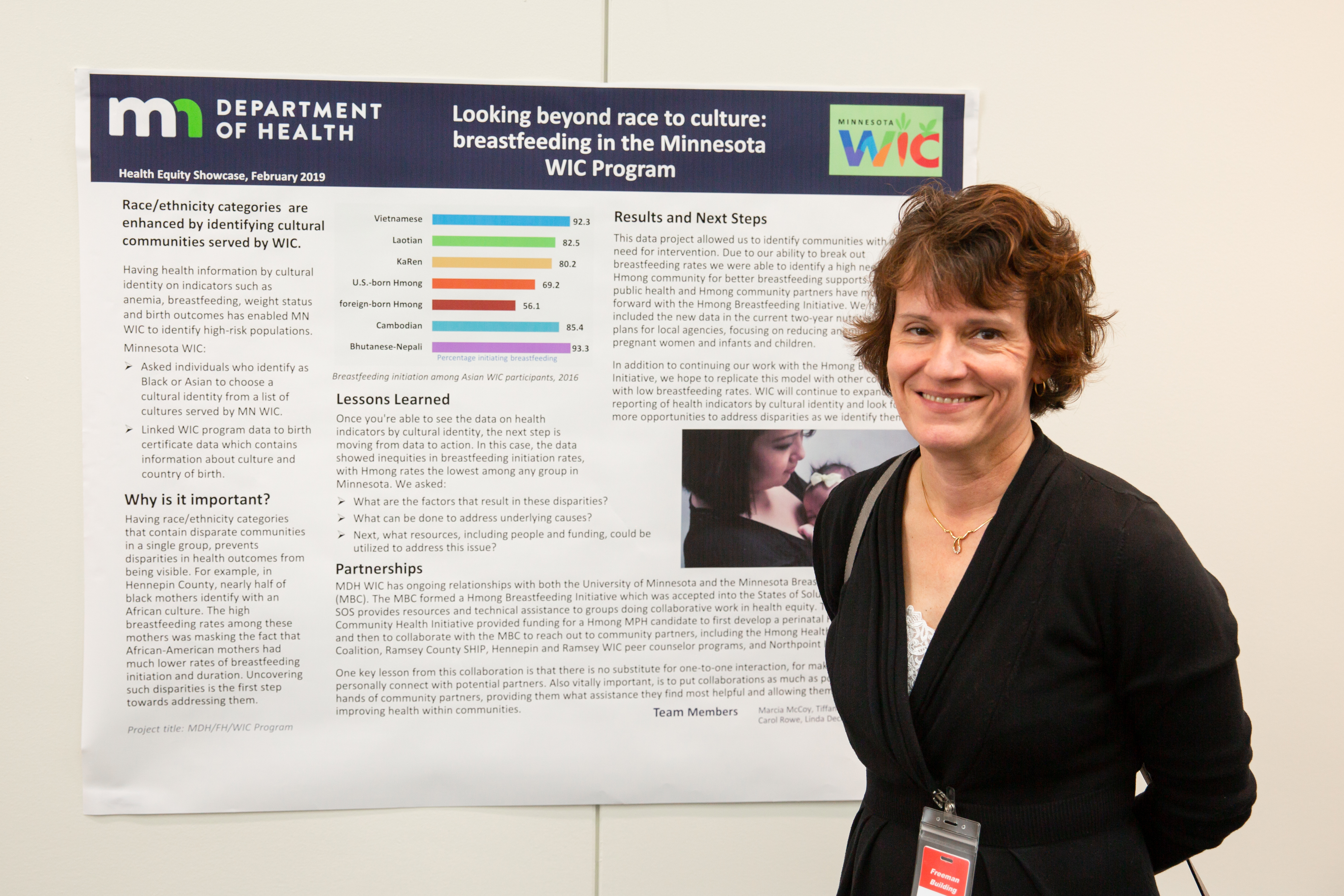 Photo of project lead with poster - WIC breastfeeding project
