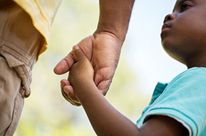 parent and child holding hands
