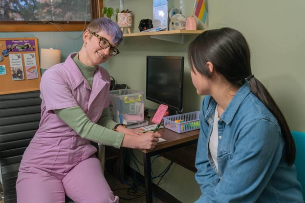 Photo of patient interaction at Annex Teen Clinic.