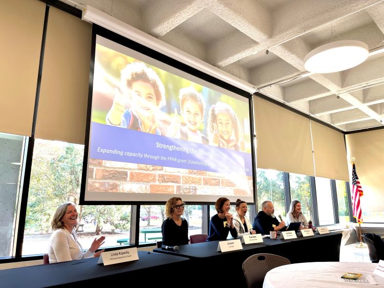 Linda Kopecky (MDH), Liz Auch (Countryside Public Health), Kiza Olson (Meeker-McLeod-Sibley Community Health Services), Sarah Reese (Polk County Public Health), Commissioner Rod Peterson (Dodge County), and Ann March (MDH) of the SCHSAC FPHR Workgroup present to SCHSAC members at the October 2025 SCHSAC retreat.
