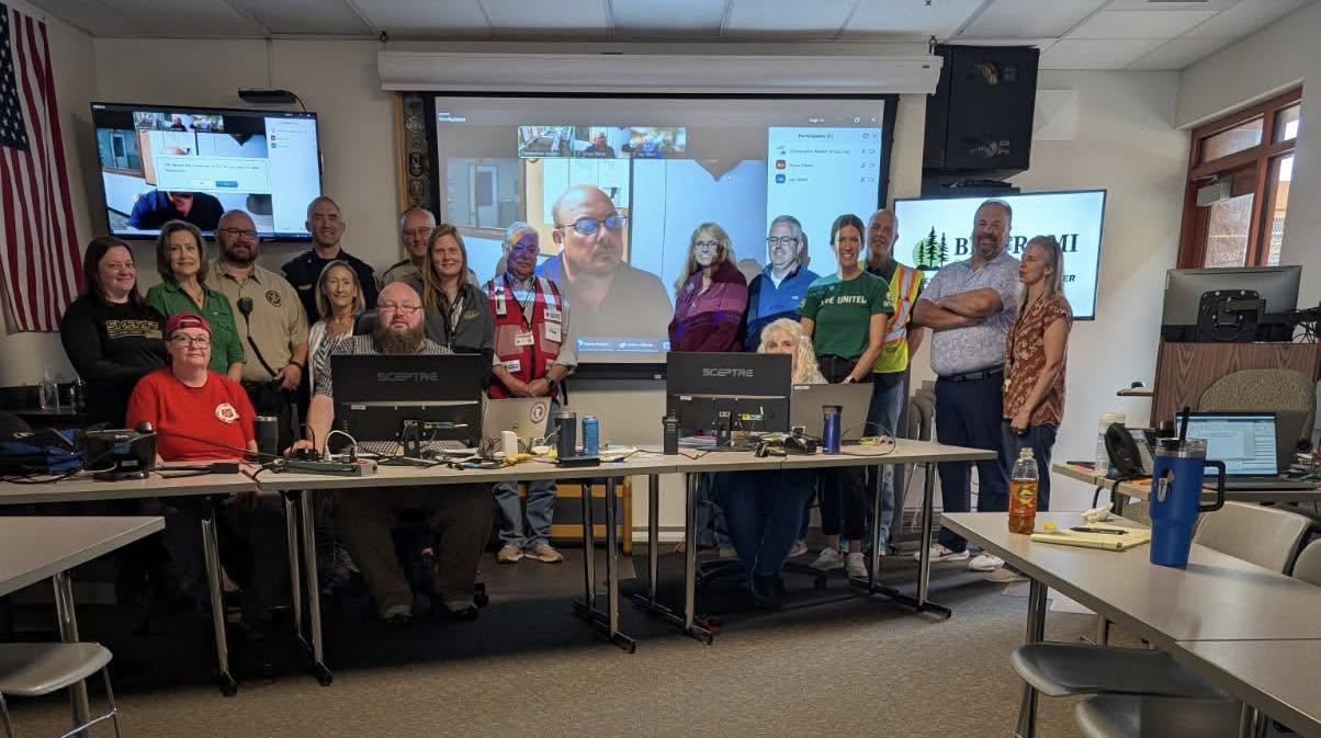 In the Beltrami County Emergency Operations Center, staff from the Beltrami County Emergency Management and Public Health departments, the Bemidji Police and Fire departments, and the Red Cross gather after a June 26 morning briefing. 