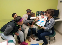 Image of nurse working with patients