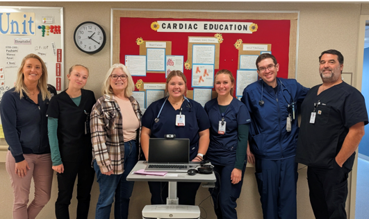 staff of Sanford Bemidji Medical Center stand in front a board that says cardiovascular health