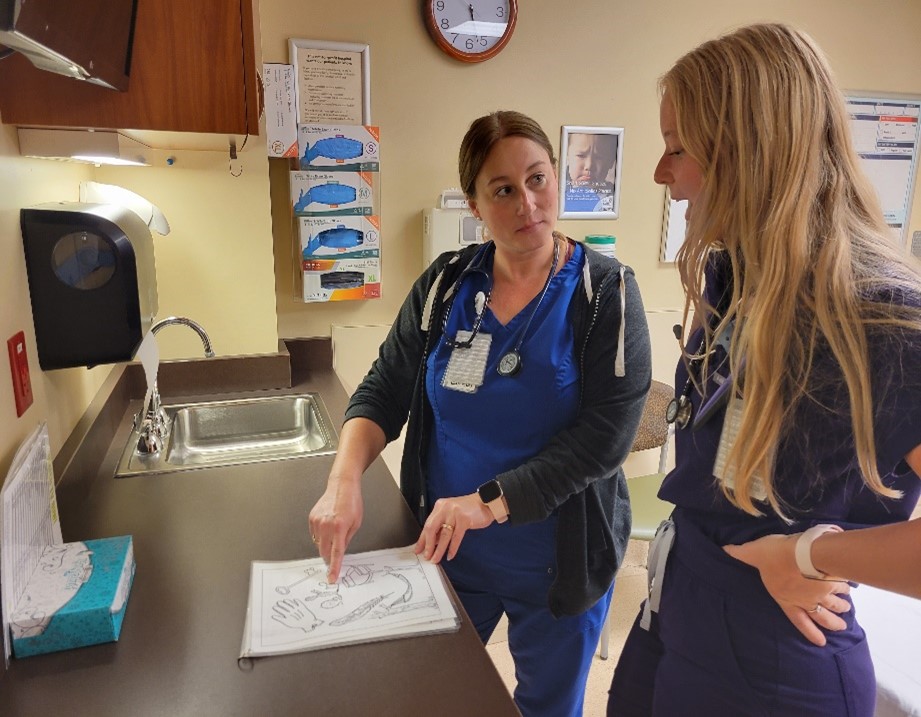 two nurses standing at a counter