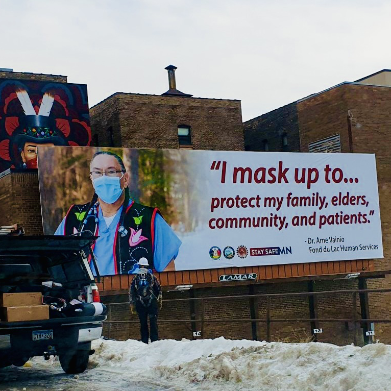 AICHO billboard: I mask up to protect my family, elders, community, and patients.
