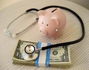 Piggy bank money and stethoscope