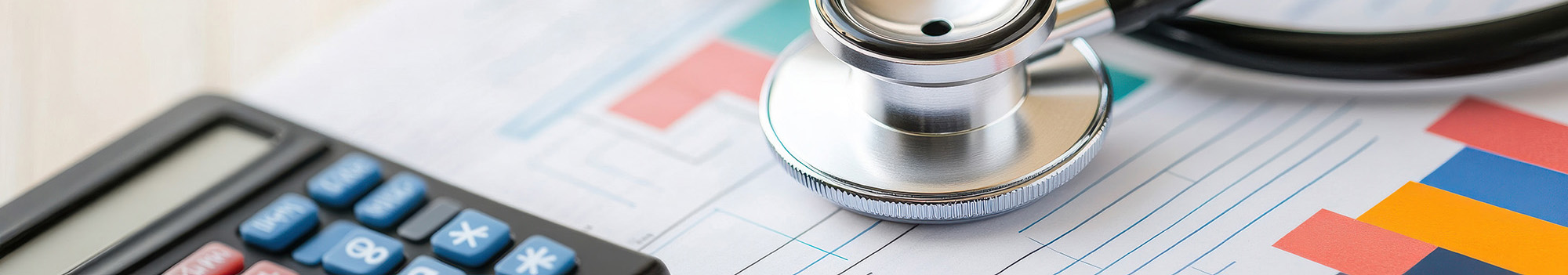 stethoscope, calculator and data charts