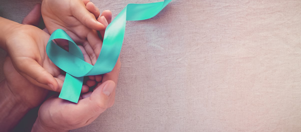 hands holding cervical cancer awareness ribbon