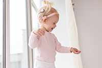 Young girl wearing a cochlear implant