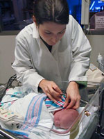 hospital staff performing a newborn hearing screen test