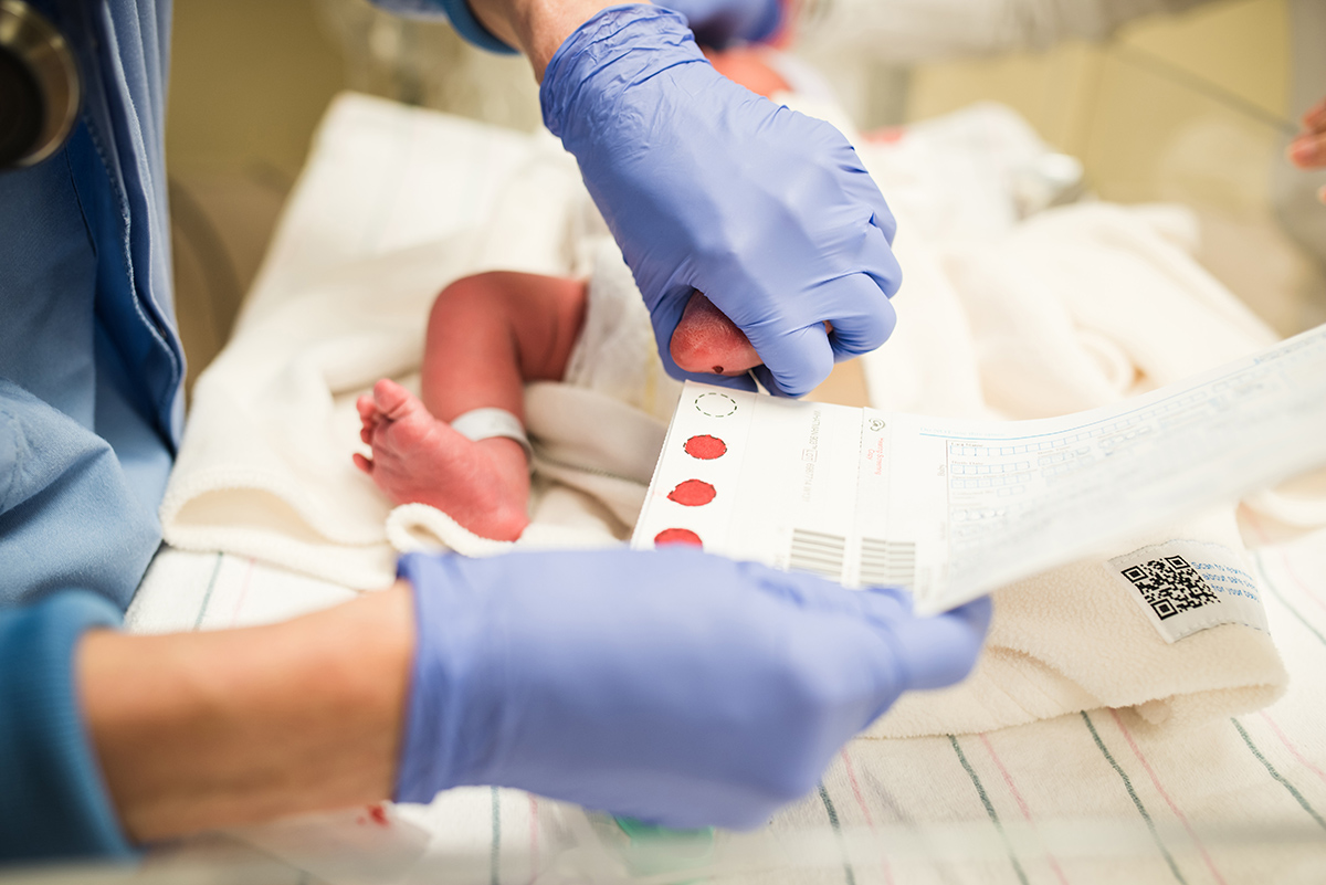 newborn receiving blood test