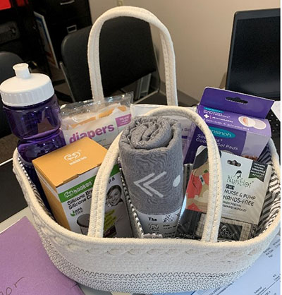 Basket with breastfeeding and infant materials.