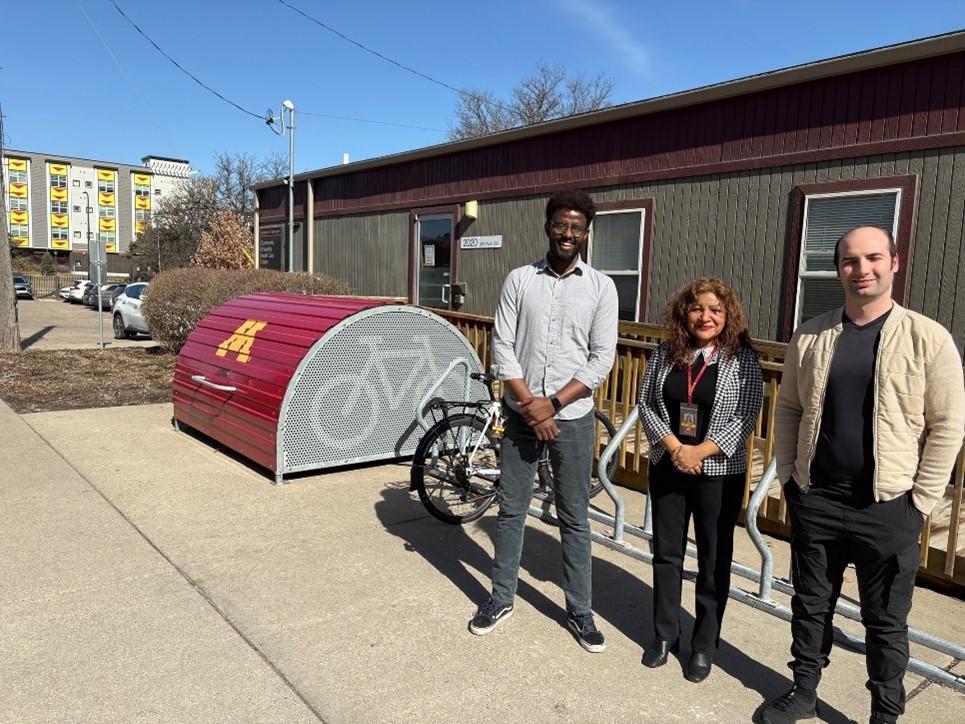 CUHCC CHWs stand in front of bike rack